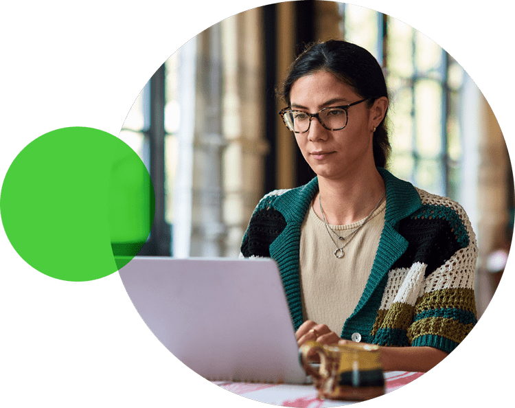 Woman wearing glasses using a laptop